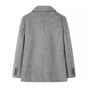 Detail view of the gray plush wool coat's back seam and four-button cuffs on the sleeves