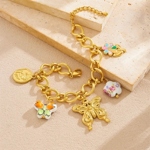 Golden bracelet set with butterfly, flower pendants and Rose engraved disc on stone base