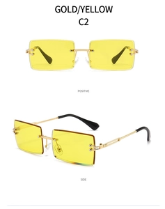 Detail view of gold rimless rectangular sunglasses with yellow gradient lenses and metal arms