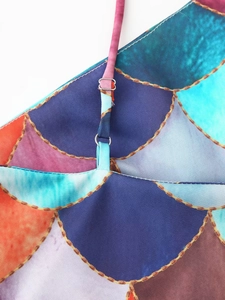 Close-up of adjustable strap buckle on a colorful mermaid print backless halter dress