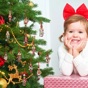 Christmas nutcracker wooden ornaments hanging on a festive tree with a happy young girl