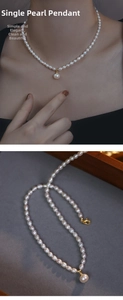 Detail of freshwater pearl necklace with large central pendant and golden lobster clasp