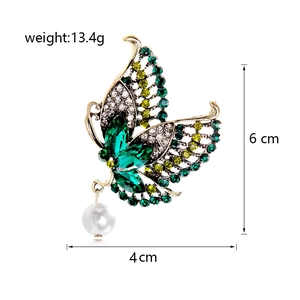 Detailed view of crystal butterfly brooch with dimensions 6x4cm and weight 13.4g