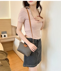 Brown crocodile pattern crossbody bag showing on-body fit for elegant styling