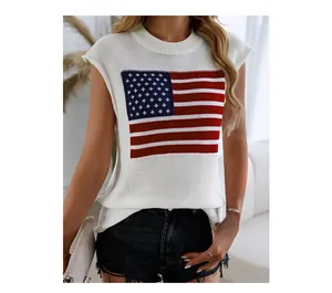 Close-up of white knitted vest with American flag print and frayed denim shorts