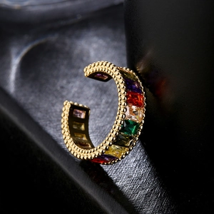 Golden ear cuff with colorful rectangular zircons and vintage milgrain detailing