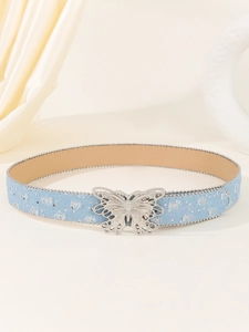 Detail of light blue denim belt with silver butterfly buckle and sparkling sequins