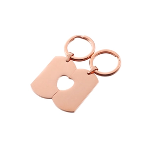 Close-up of rose gold toast-shaped couple keychains forming a heart cutout