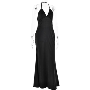 Detail showing the floor-length hem and smooth fabric of the black halter evening dress