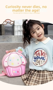 Detailed view of a pink cupcake-shaped kids' chest bag with colorful polka dots