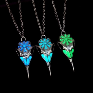 Retro luminous viking raven skull necklaces in blue, cyan and green glowing light effects