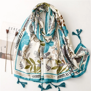 Ethnic summer beach shawl with tropical floral print and peacock blue tassels for women