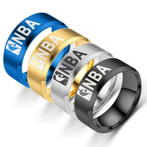 Macro detail of NBA logo on brushed stainless steel basketball rings in four colors