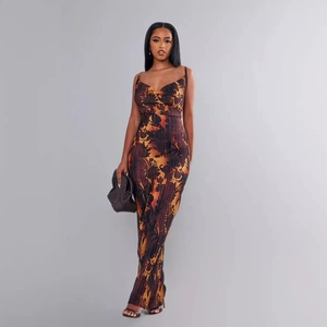 Slim fit pleated maxi dress with abstract print and thin straps for a stylish silhouette