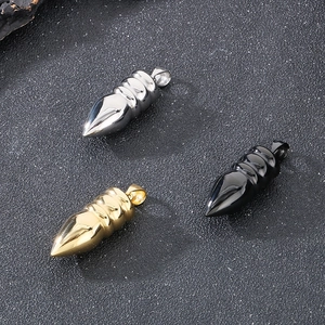 Detail view of bullet shaped titanium steel pendants in silver, gold, and black finish