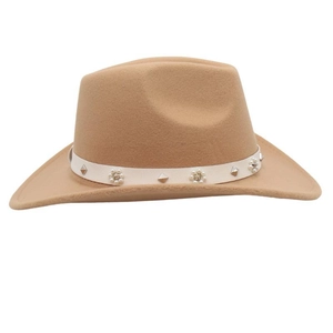 Close-up of camel felt cowboy hat with pearl flower band and metallic stud details