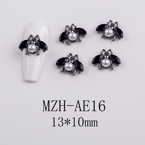 Detail of bee nail charm with white pearl and black zircon wings, size 13x10mm