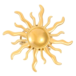 Macro shot of polished gold sun-shaped napkin ring with radiant textured waves
