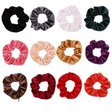Set of 12 colorful velvet hair scrunchies in various shades for elegant bun styling