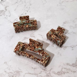 Three-piece set of tortoiseshell acetate hair claws in rectangular and square shapes