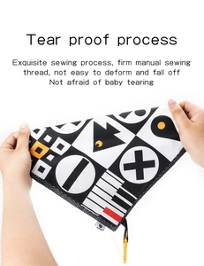 Detail showing the tear-proof fabric and strong manual sewing of the baby cloth book
