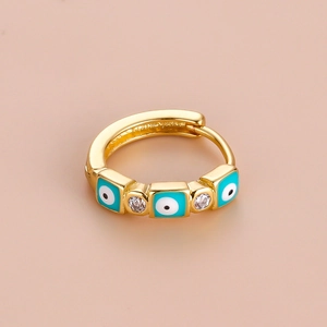 Bohemian gold hoop earring featuring blue evil eye charms and cubic zirconia accents