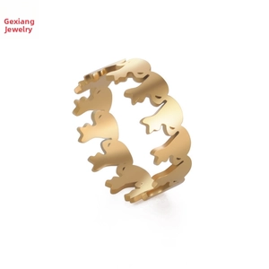 Close-up of golden stainless steel ring featuring unique hollow cartoon elephant designs