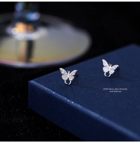 Macro shot of S999 sterling silver butterfly earrings with shimmering pavé zircon stones
