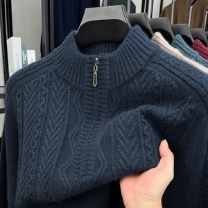 Detail showing high-quality cable knit texture and navy half-zip stand collar on men sweater