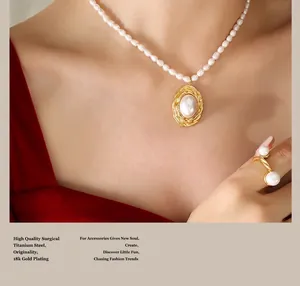 Detail of 18k gold plated surgical titanium necklace and ring set with freshwater pearls