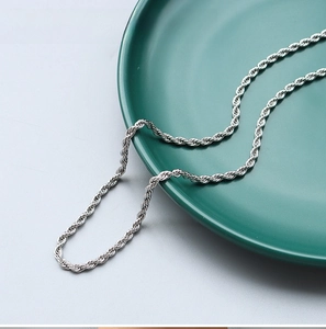 Close-up of a 3mm wide silver stainless steel rope chain with twisted metal texture