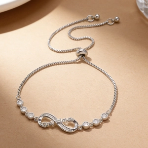 Detail of silver infinity slider bracelet with Grandma engraving and micro-set zirconias