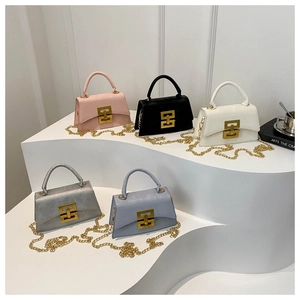 Close-up of stylish mini shoulder bags with golden H buckles and chain straps in five colors