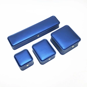 Deep blue PU leather jewelry box set featuring four various sizes on a white background