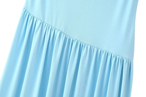 Detail shot of blue mesh dress showing ruched fabric texture and pleated design elements