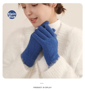 Detail of Klein Blue knitted glove featuring diamond weave pattern and soft thermal texture