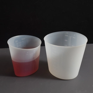 Detailed scale view of transparent 250ml and 2L silicone measuring cups for DIY craft