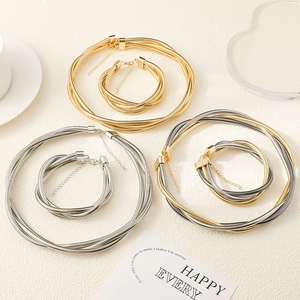 Three-layer spring coil necklace and bracelet set in gold, silver, and mixed metallic tones