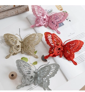 Detail of glitter butterfly ornaments in four colors with intricate hollow patterns