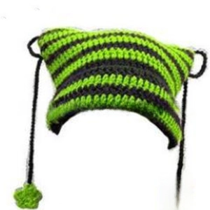 Detail of green and black striped crochet cat ear beanie with hanging star tassels