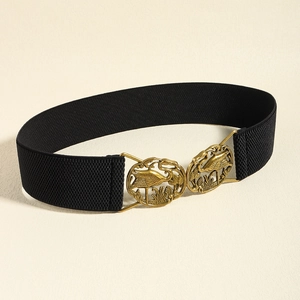 Detail of a black elastic waist belt featuring a bronze crane relief metal buckle