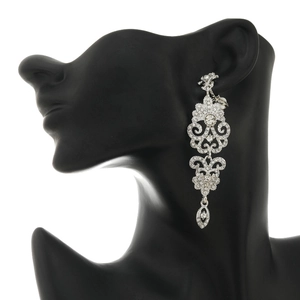 Elegant vintage silver long drop earrings with crystals on a black model silhouette