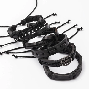 Detailed view of 6-piece black leather bracelet set with tree of life metal pendant