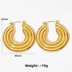 Detail of gold chunky C-hoop earrings with 42mm size and 19g weight measurement