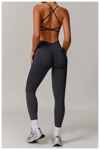 Macro detail of high-waist seamless yoga leggings with scrunch butt lift and crossed back bra