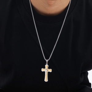 Detail of multi-layer stainless steel cross pendant on silver chain for men