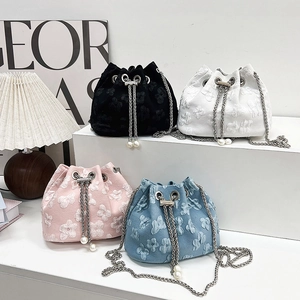 Textured floral chain bucket bags in black white pink and blue colors with pearls