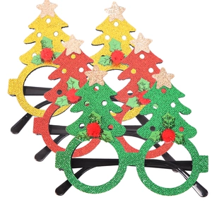 Detailed close-up of glittery Christmas tree glasses in gold, red, and green festive colors