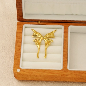 Elegant gold titanium butterfly stud earrings with 3D wings in a premium jewelry box