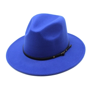 Detail of royal blue wool fedora hat featuring a black leather band and gold buckle
